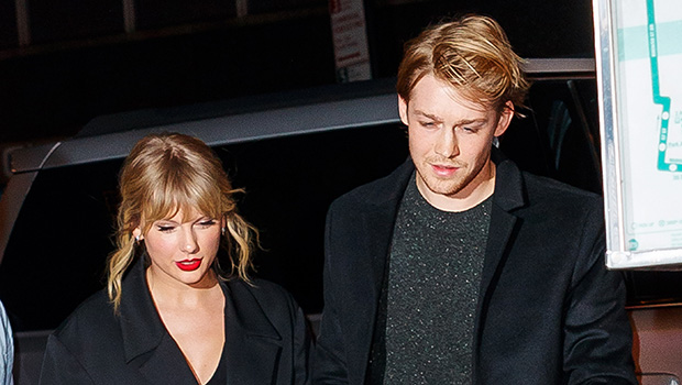 Taylor Swift and Joe Alwyn holding hands while walking